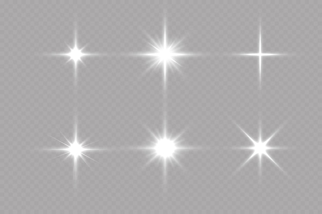 White sparkles.Bright star.Glow burst.Rays of the sun on a transparent background.