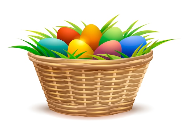 Wicker basket full of Easter eggs on grass