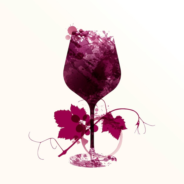 Wine glass with red wine stains and silhouette of vine leaf and grapes