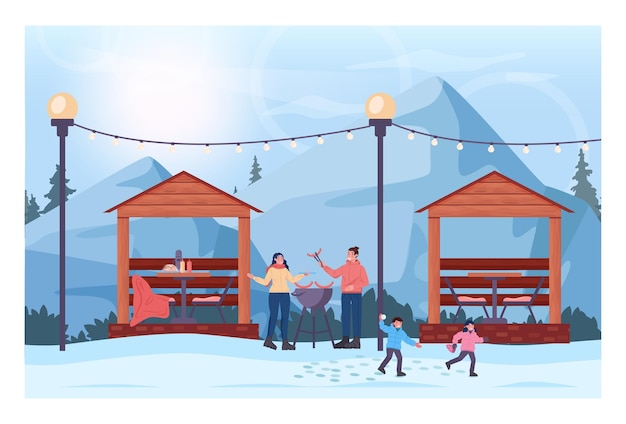 Winter bbq concept. family grilling hot dogs in outdoor kitchen, ski resort