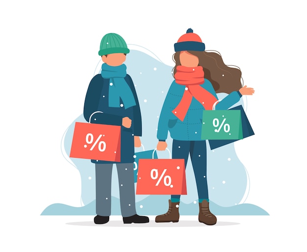 Winter sale, man and woman with shopping bags in winter.