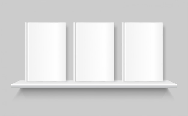 Witte lege boeken op een boekenplank. lege omslag van boek. plank op de grijze muur.