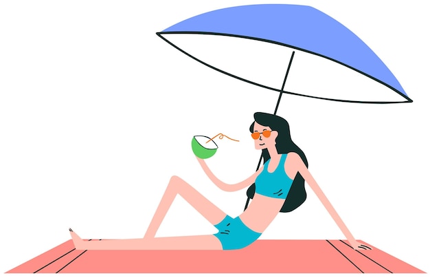 코코넛 얼음이라고 적힌 우산을 들고 해변에 있는 여자.