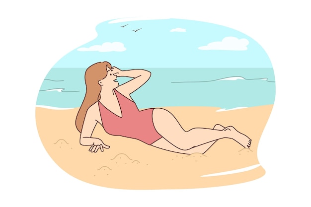 Woman in bikini lying on beach