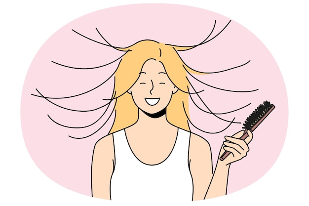Woman combs hair and smiles seeing effect of static magnetization of hairstyle