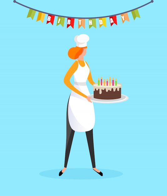 Woman cook in apron holding birthday cake in hands