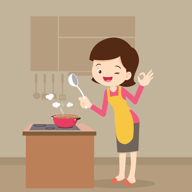 Женщина приготовления пищи, показывая знак ок