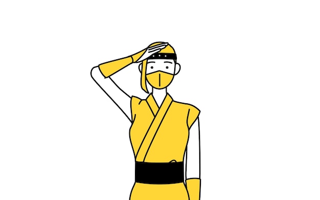 A woman dressed up as a ninja making a salute