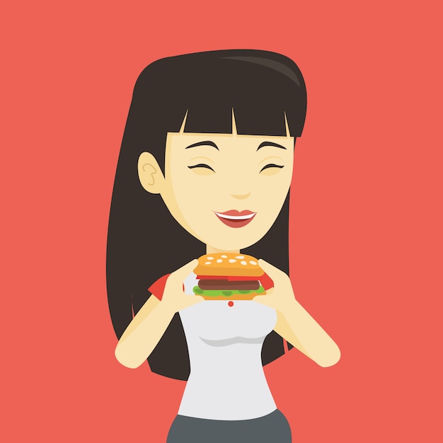 ハンバーガーを食べる女性。
