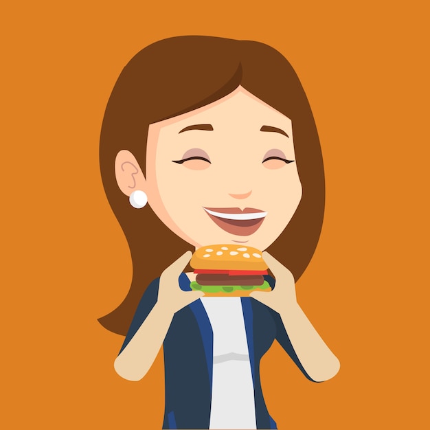 Woman eating hamburger  .