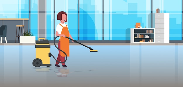 woman holding professional vacuum cleaner female cleaner janitor in uniform cleaning service floor care modern co-working office interior 
