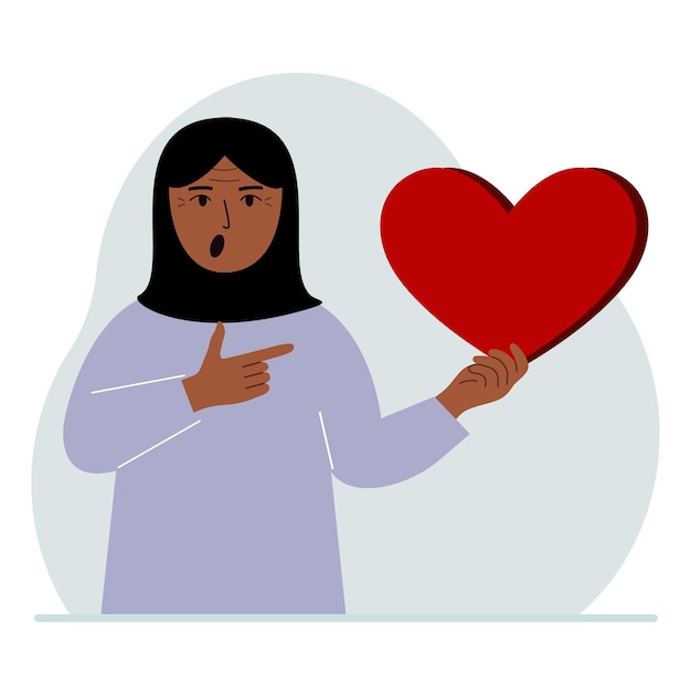 A woman holds a big red heart in his hand the concept of volunteering romantic relationship or love