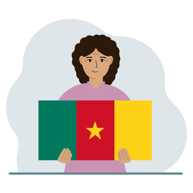 A woman holds the flag of Cameroon in his hands The concept of demonstration national holiday or patriotism Nationality