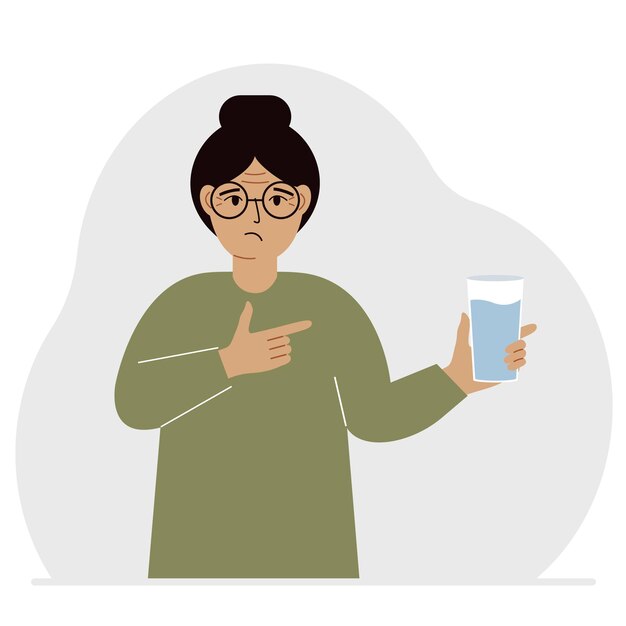 Vector a woman holds a glass of water in his hand the concept of water balance and health