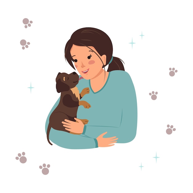 A woman holds a labrador retriever puppy in her arms