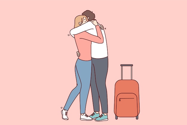 Woman hugging man with suitcase