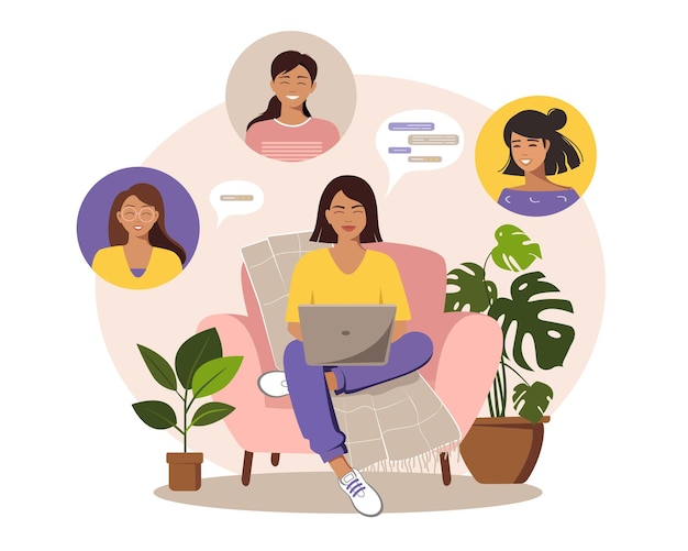 a woman is sitting on a chair with a laptop and chatting with colleagues or friends