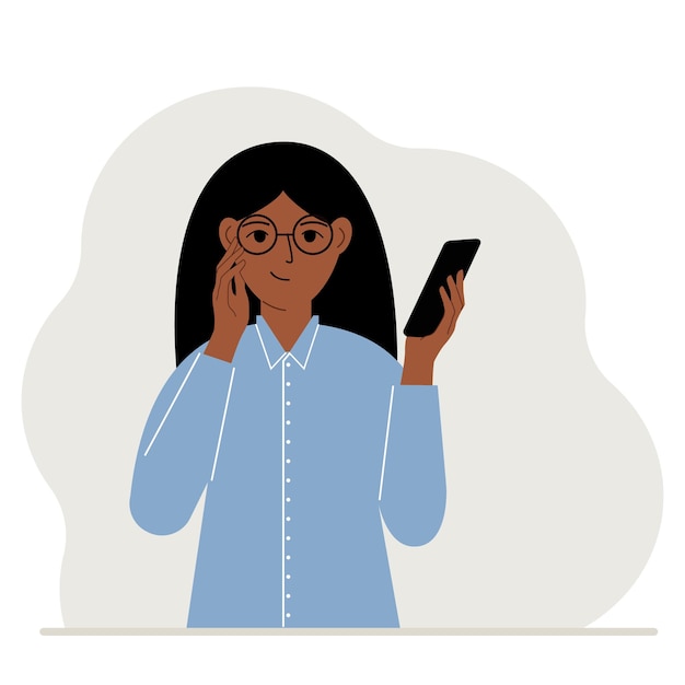A woman looks at a mobile phone. A woman happily looks at the phone he holds in his hand. Vector