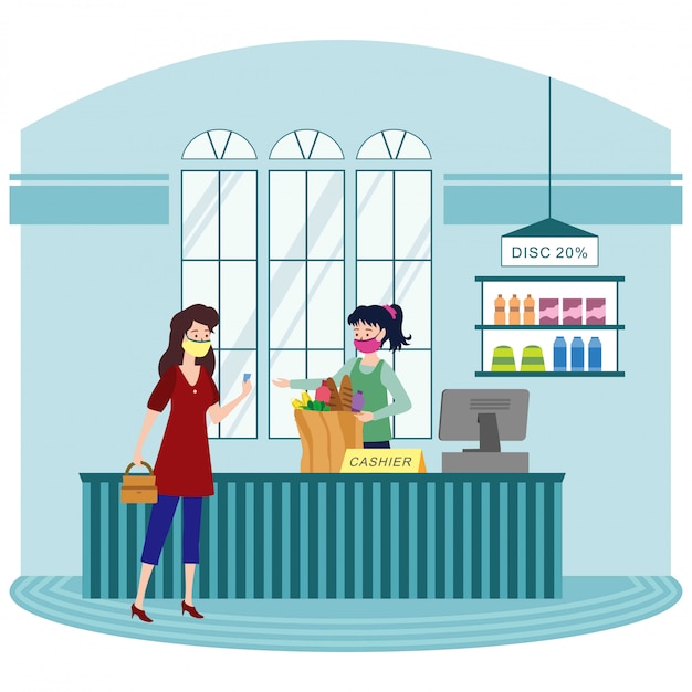 A woman paying her items at groceries shop cashier