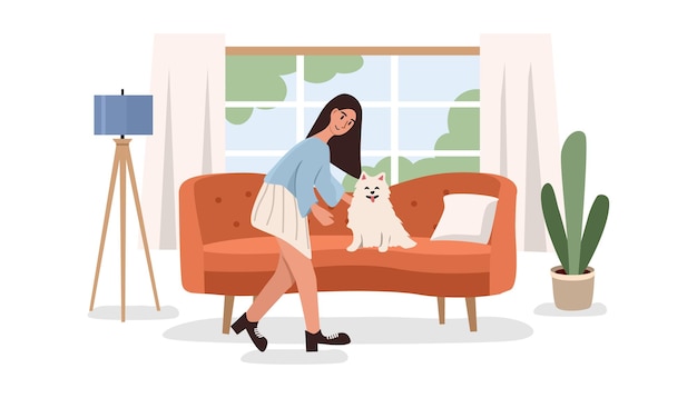 woman petting her dog on the sofa