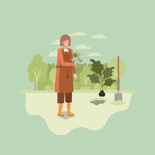 woman planting tree in the park with shovel