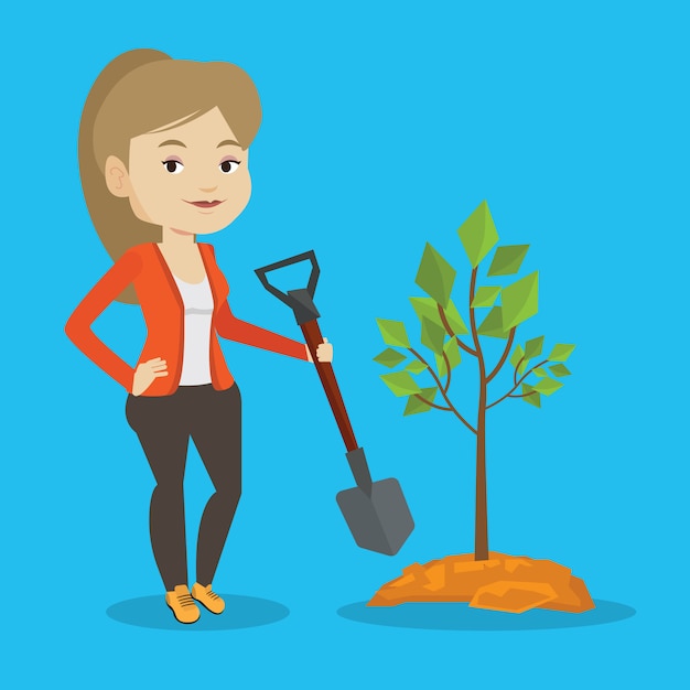 Woman plants tree.