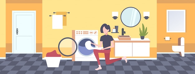 Vector woman putting dirty clothes into washing machine housewife doing housework modern laundry room interior cartoon character full length horizontal