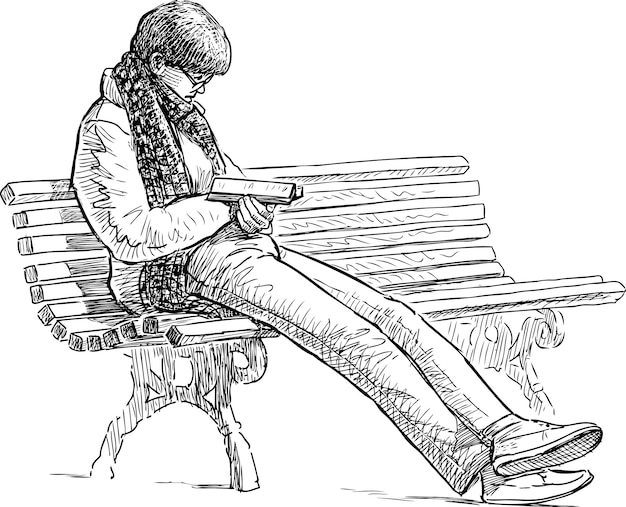 여자는 공원 벤치에서 읽습니다.