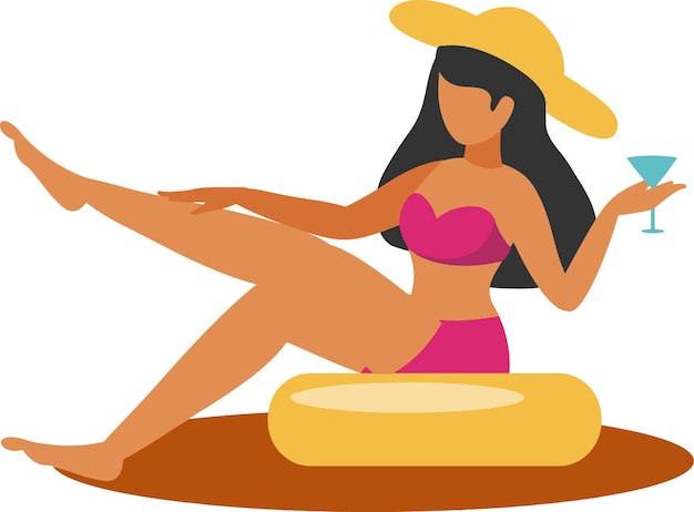 Woman relaxing on the beach with a cocktail in the summer