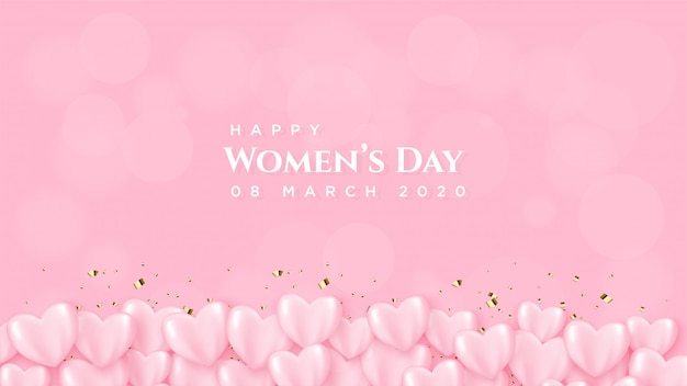 Il giorno di una donna con un palloncino rosa con scritte bianche.