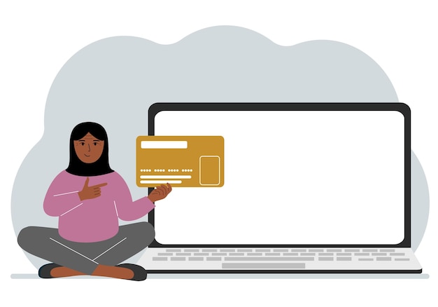 Una donna siede a gambe incrociate e tiene in mano una grande tessera di plastica accanto alla donna c'è un grande laptop con spazio per il testo