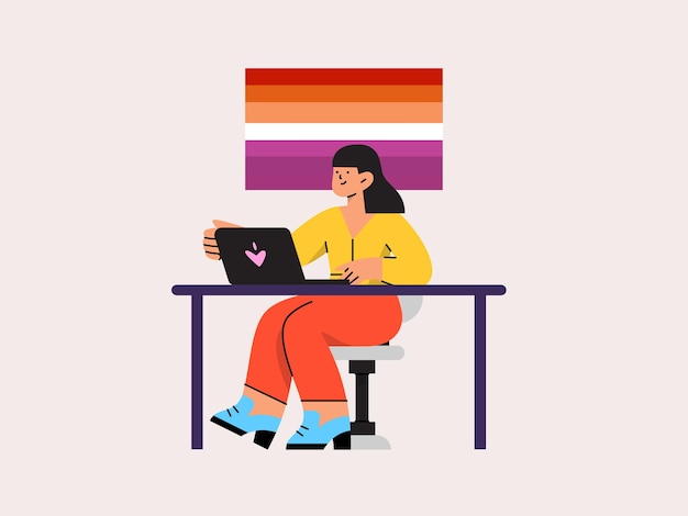 a woman sits at a desk with a laptop and a rainbow colored banner behind her