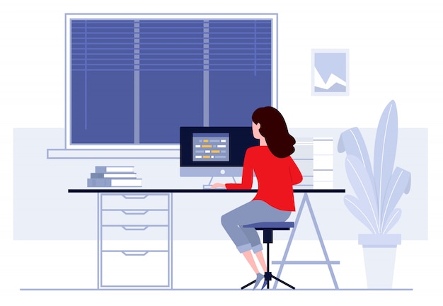 Woman sitting at table and working at home.