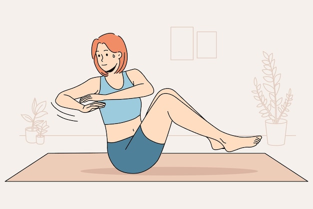 Женщина тренируется на коврике дома