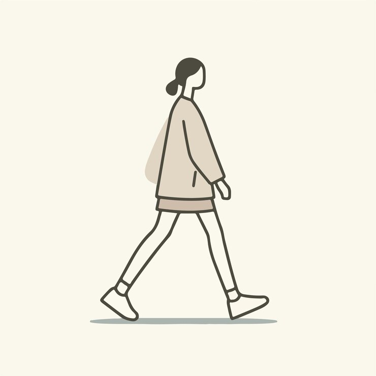 女性が急いで歩いている