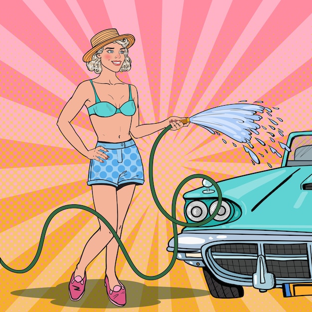 Woman washing classic car with hose