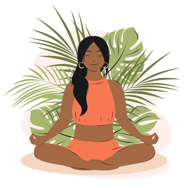 Woman with dark hair and skin meditates and sits in lotus position on the nature