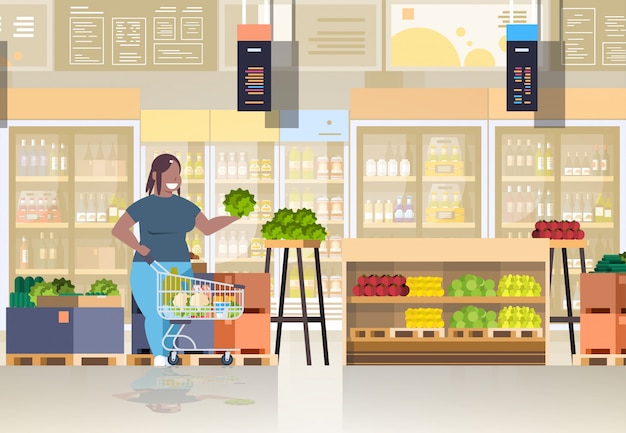 Vector woman with shopping trolley cart choosing vegetables and fruits  concept   girl supermarket customer