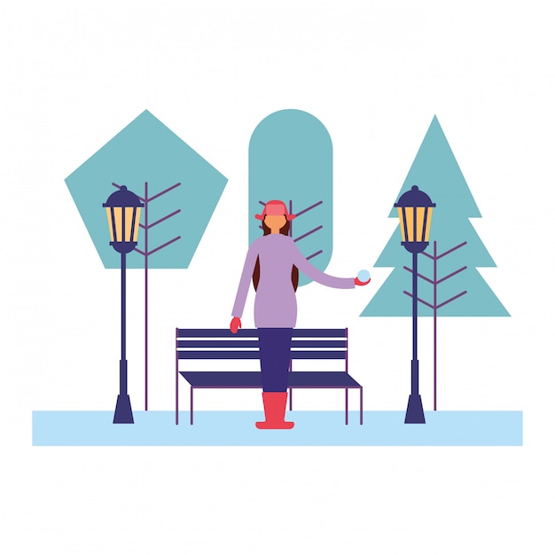 Donna con abiti invernali nel parco