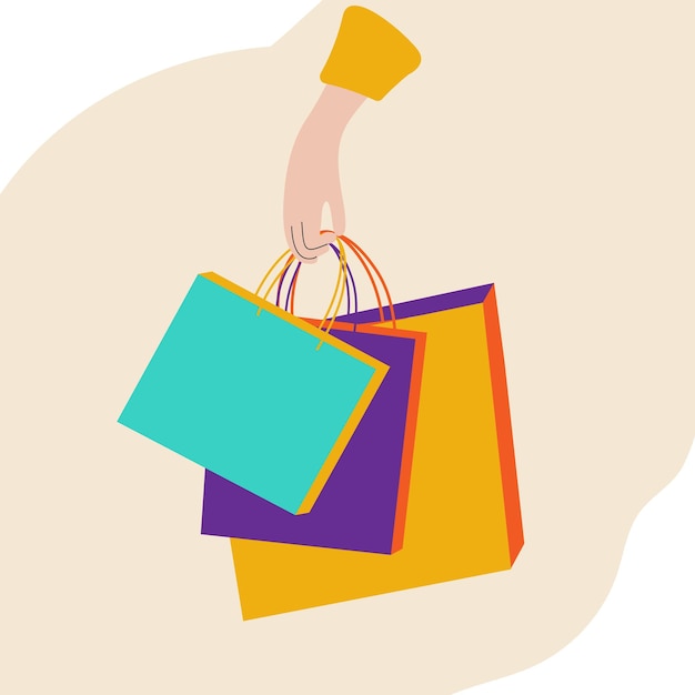 Womans hand holds shopping bags marketing concept of gifts shopping discounts sales