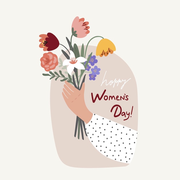 Womans hand holds a spring bouquet of flowers for international womens day