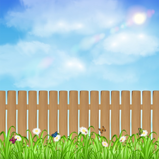 草の花と空の背景と木製フェンス