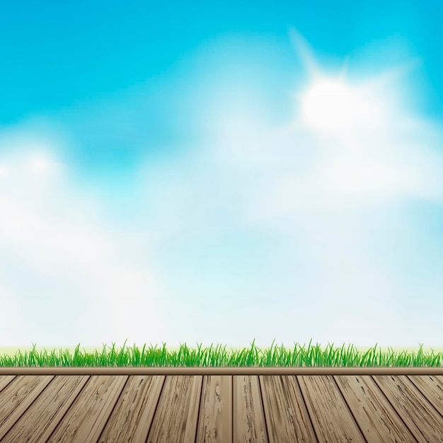 wooden floor with grass over blue sky