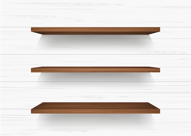 Wooden shelf on white wall background.