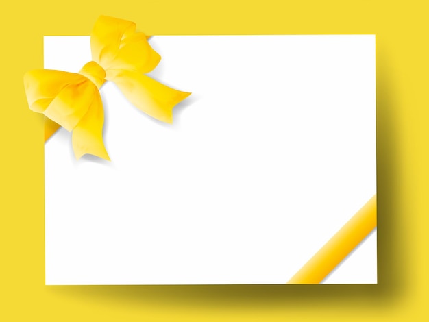 Yellow gift bow with ribbon on a white background