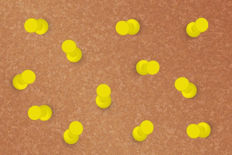 Vector yellow pins in different position on a cork board