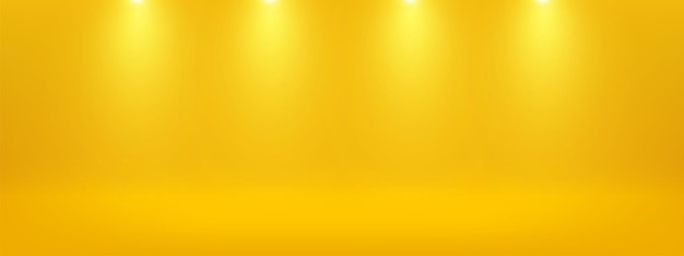 Желтый студийный фон с прожекторами для рекламы и шоу продукта
