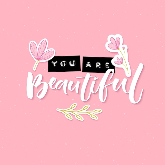 You are beautiful. inspirational quote with embossed metal letters and modern brush calligraphy decorated with hand drawn flowers on pink background. trendy collage for social media and apparel.