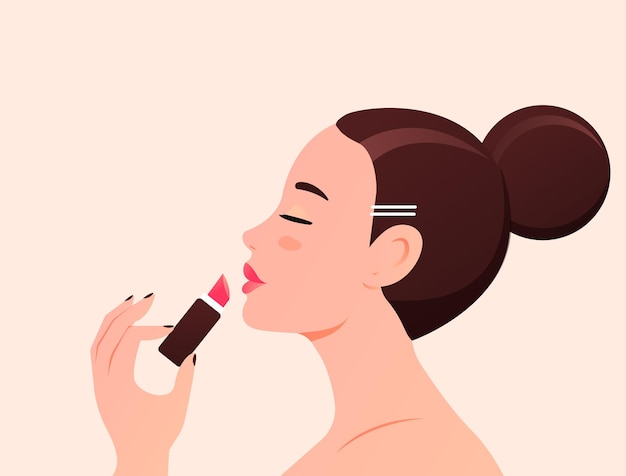 young beautiful woman paints lips with a lipstick
