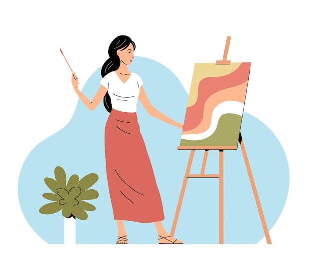 a young beautiful woman paints a picture on canvas